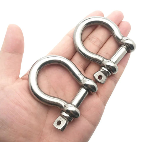 Two Pack Three Eighth Inch Screw Pin Anchor Shackle Premium 304 Stainless Steel Heavy Duty Rigging in a hand.
