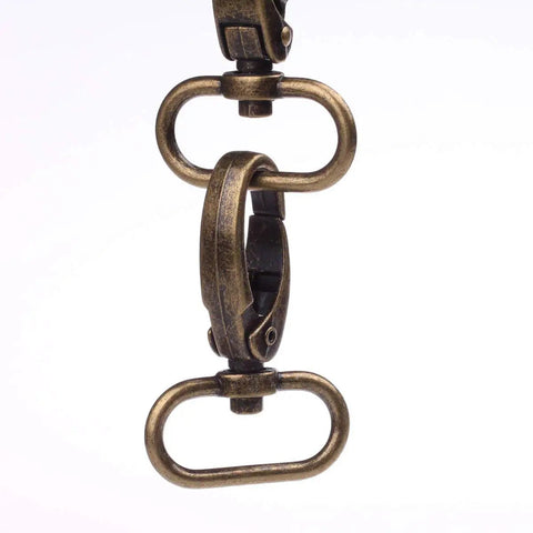 Dead Nuts Sturdy Curved Zinc Alloy Swivel Trigger Clasps For One Inch Webbing Bag Hardware Pack Of Twenty close-up of antique brass swivel clasp