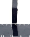 Side view of Rectangle Silicone Rubber Bumper Feet One And One Half Inch By One Inch Three Sixteenth Inch Thick with ruler for size reference