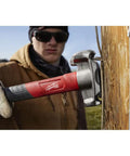 Absolute Beast Heavy Duty 4In1 Lineman Hammer 36 Oz Strike Built Different For Electricians And Job Site Pros Tough As Nails With Grippy Handle hitting a nail into wood.