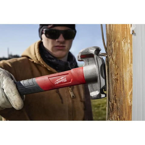 Absolute Beast Heavy Duty 4In1 Lineman Hammer 36 Oz Strike Built Different For Electricians And Job Site Pros Tough As Nails With Grippy Handle hitting a nail into wood.
