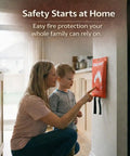 Woman showing child how to use Fire Blanket Survival Cover For Kitchen And Home Safety Heat Protection Against Small Cooking Fires And Emergencies Emergency Fire Suppression Tool For Quick Easy Use mounted on wall.
