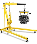 Heavy-Duty 2 Ton Hydraulic Engine Hoist And Cherry Picker Crane with engine, yellow steel, has locking casters and adjustable height.