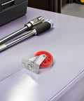 Hella Smooth Nylon Caster Wheels For Mechanic Creepers Providing Straight Up Quiet Rollout And Rock Solid Swivel Control For Effortless Shop Floor Cruising on a tool bench.
