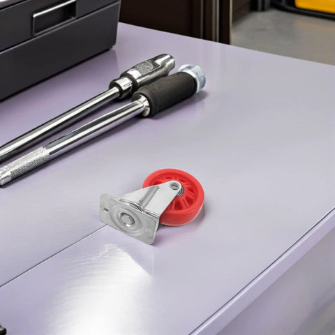 Hella Smooth Nylon Caster Wheels For Mechanic Creepers Providing Straight Up Quiet Rollout And Rock Solid Swivel Control For Effortless Shop Floor Cruising on a tool bench.