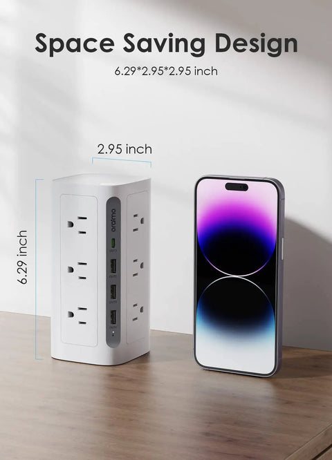 Must Have Boss Level Compact Power Tower Surge Protector with USB ports next to smartphone, showing space-saving design, 6.29x2.95x2.95 in.