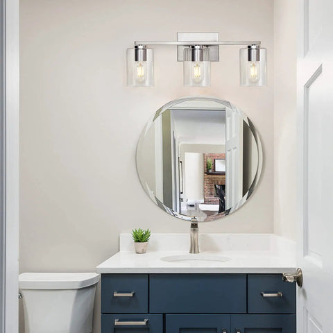 Three Light Vanity Wall Light in Brushed Nickel for Bathroom Over Mirror, showcasing modern design with glass shades