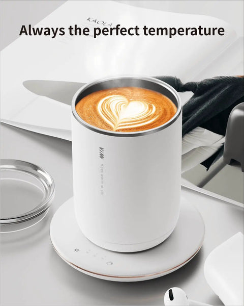 Self Heating Coffee Mug With Smart Temperature Control And Self Stirring Keeps Your Morning Coffee legit hot and buttery smooth all day long rechargeable beverage warmer on a desk.