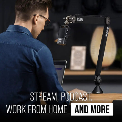 Man using PSA1+ Pro Studio Desk Boom Arm With Spring Damping, Cable Management, And 360 Degree Rotation, Black, on desk