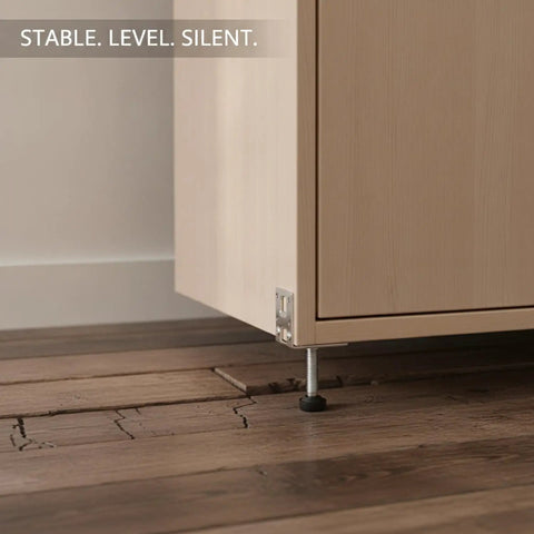 Adjustable Shimless Side Mount Leveling Feet For Cabinets And Furniture Eliminates Wobble With Micro Adjustable Threaded Steel Feet For Kitchens And Wardrobes Silver One Piece supporting a cabinet above wooden floor.