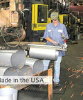 Worker fabricating metal parts in a factory, showcasing the production of wall mounted garage vacuum with 50 ft hose and tools