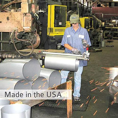 Worker fabricating metal parts in a factory, showcasing the production of wall mounted garage vacuum with 50 ft hose and tools