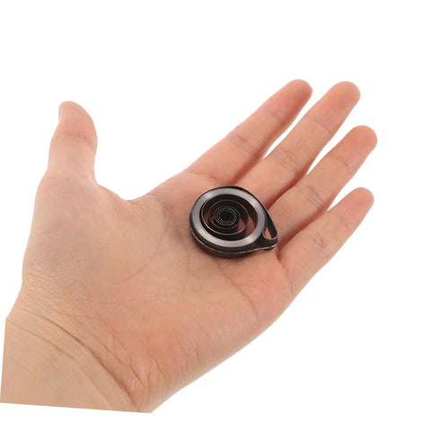 Hand holding a precision spring from Pro Grade Mechanical Alarm Clock Repair Kit With Precision Springs And Winding Key Assembly