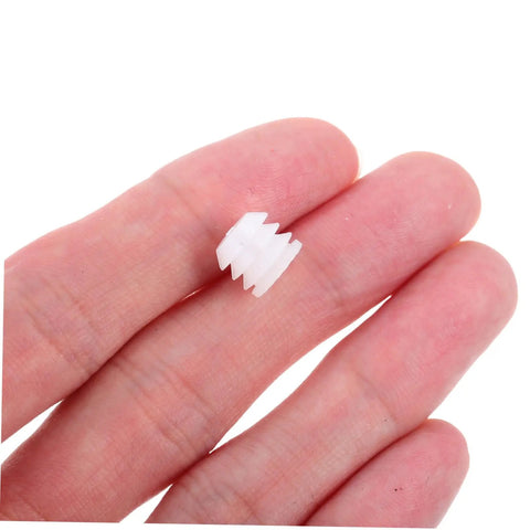 Two Hundred Piece Cabinet Fitting Kit With Rock Solid Self Tapping Screws And Heavy Duty Metal Connectors, white nylon screw plug in hand.