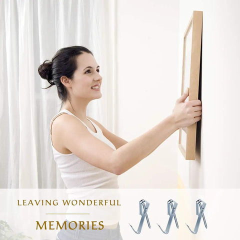 Picture Hanging Kit With 100 Hangers And 120 Nails Holds Up To 30 Lbs Each Easy Install For Wood Or Drywall displayed with woman hanging frame