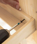 50Pcs No 10 X 3/4 Inch Phillips Head Self-Tapping Screws installed in wooden surface with drill, demonstrating usage in wood.