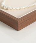 Slick Walnut Wood Jewelry Display Tray With Dope 24 Compartments For Rings Earrings Necklaces, corner detail with pearl necklace.