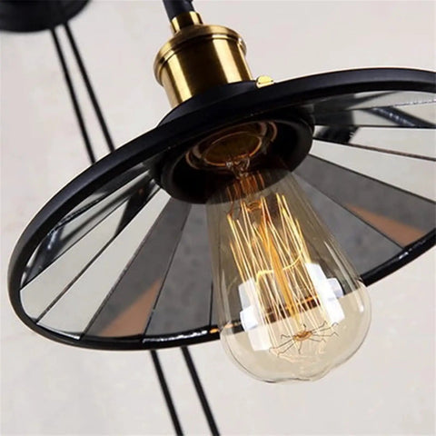 Dope Vintage Wall Sconce Featuring Classic Wrought Iron Build With Handsome Pulley Adjustment For Slick Loft Rooms And Chill Bar Decor That Seriously Slays And Looks Absolutely Lit, showcasing a brass socket with a glass bulb.