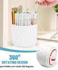 360 Degree Rotating Pen Organizer with diamond-like design holding pens and pencils, showcasing its rotation feature on a desk.