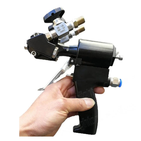 Professional PU Foam Spray Upgrade Gun With Air Purge Valve And Rugged Carrying Case For Smooth Polyurea Coating And Quick Cleanup Like A Boss On Construction Sites held in hand showing trigger and nozzle.