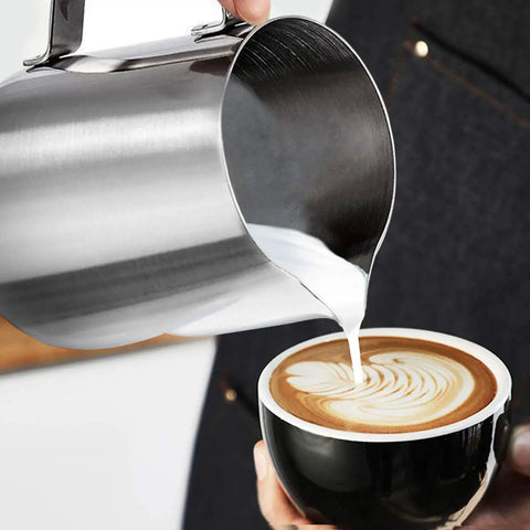 Milk Frothing Pitcher 12oz And 20oz Stainless Steel Jug For Espresso Machines And Latte Art, Food Grade 304 Stainless being used to create latte art
