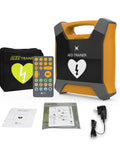 AED Trainer XFT-120GA orange defibrillator training device with remote, carrying case, power adapter, and manuals