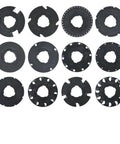 Top view of 12 black seed plates from the Seed Plate Set 60009 and 60010 for Garden Seeder, 12 Pack, arranged in rows, fits 10001 and 1001-B Disc.