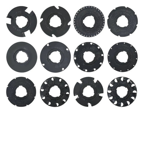 Top view of 12 black seed plates from the Seed Plate Set 60009 and 60010 for Garden Seeder, 12 Pack, arranged in rows, fits 10001 and 1001-B Disc.
