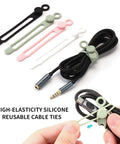 Silicone Cable Ties Reusable Cord Management Organizer For Home Office And Tech Cables Multipurpose Elastic Tie For Bundling And Fastening Wires No Fuss Soft Flexible Durable Black White Pink Green, shown in use fastening cables.