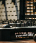 No Sweat 89 Piece Gunsmithing Screwdriver Set With Hollow Ground Bits And Textured Rubber Drivers Featuring Black Phosphate Coating And Molded Travel Case For Quick Rifle Maintenance And Range Run showing organized driver bits in a black storage case.