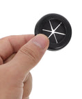 Cool Dual Sided Desk Grommet Kit For Cable Management, 4 Pack Black Rubber Plugs Waterproof And Heavy Duty For Protecting Wires Inside Office Or Home Workspaces. Hand holding one black rubber desk grommet
