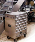Rock Solid Stainless Steel Mobile Roller Cabinet With Seven Drawers Shop Tool Storage Workbench in industrial setting.