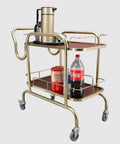 Slick Two Tier Serving Cart Crafted From Solid Stainless Steel Smooth Glide Casters And Top Handle No Sweat Moving Industrial Grade Rolling Rack For Home Bar Kitchen Or Commercial Wine Setup with beverages and teapot.