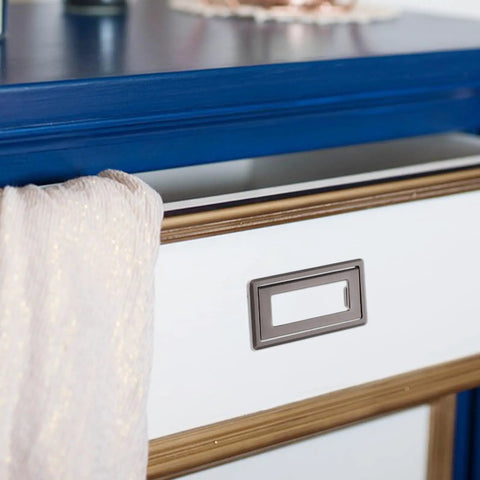 Hidden Cabinet Door Handle Set In Zinc Alloy, Flush Mount Sliding Pulls on a white drawer with blue table backdrop