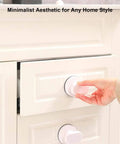 Hand installing 2 Pack Suction Cup Handles For Glass Surfaces And Smooth Walls No Drilling Required Installation on cabinet drawer