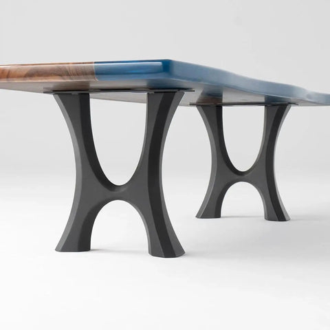 Beefy heavy duty industrial modern coffee table legs 13 inch wide 16 inch high set of two with curved lines supporting a table