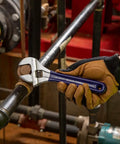 Worker using Extra Wide Jaw Adjustable Wrench 8 Inch Forged Drive Tool With High Polish Chrome Finish Built For Tight Spaces.