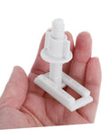 Person holding a white screw from 2 Pack Toilet Seat Mounting Bolts And Nuts With Quick Release Plastic Screws For Bidet Toilet Seat Fixing Ultra Durable Plastic And Rubber Hardware Kit For No Fuss Install And Universal Fit