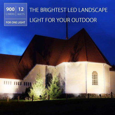 Two Pack 12W LED Landscape Lights illuminate church exterior at night, highlighting architecture and trees, 900 Lumens warm white 3000K