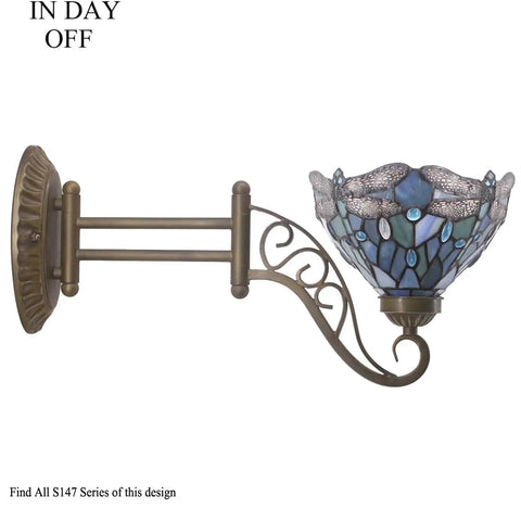 Side view of Tiffany Style Wall Sconce Plug In Swing Arm Light With Sea Blue Stained Glass Dragonfly Motif, Antique Green Bronze Base