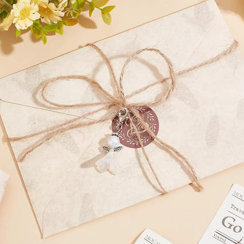 DIY Guardian Angel Pendant Kit With 420 Pieces Beads Tibetan Style Alloy Wings Keychain on a wrapped package