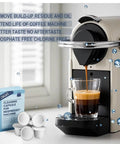 Cleaning Capsule Pods For Nespresso OriginalLine Machines 6 Pack Descaling Pods And Cleaning Solution To Remove Residue And Oils box and pods beside machine