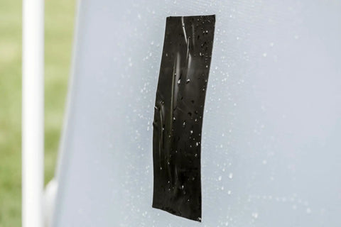 Heavy Duty Waterproof Repair Tape For Wet And Rough Surfaces Including Underwater Leaks Patching Up Like A Pro Indoors Or Outdoors 2 Inch By 5 Foot Black One Roll, shown applied to a wet surface.