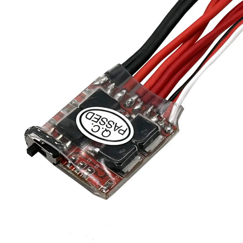 Close-up of 30A Brushed ESC with Brake for DIY Mini RC Cars Boats Crawlers, showing wired connectors and quality control sticker.