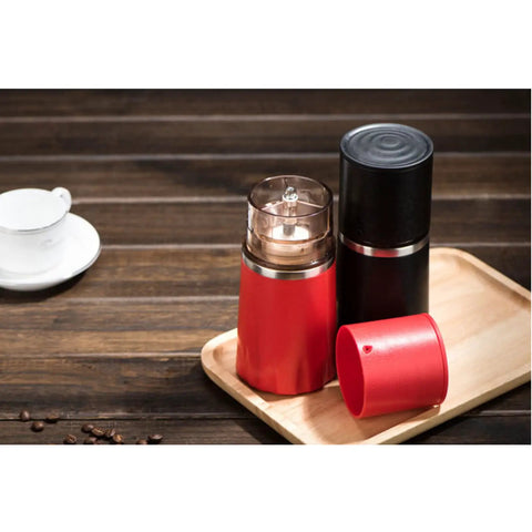Kickstart Your Morning Anywhere With This Portable Manual Coffee Maker Equipped With Integrated Grinder And Bean Compartment Ideal For Camping Runs And Highway Hauls Pull Smooth Rich Brews Straight To Mug Effortless. Red and black travel coffee maker with grinding top.