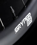 Close-up of matte black Gravel Road Carbon Wheelset 700C Ultralight Disc Clincher Tubeless Ready 35mm Depth, T-LOCK spokes visible.