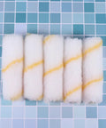 Five mini foam paint roller sleeves in white with yellow stripes, part of the 30 Piece Mini Foam Paint Roller Sleeve Refill Set For Interior Walls Doors And Baseboards High Density Texture Promises A Slick Finish And Easy Cleanup For Weekend Warriors And Pros.