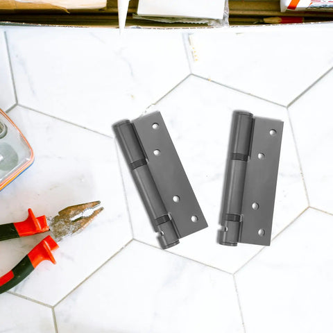 Self Closing Door Hinge Stainless Steel Hidden Design With Strong Spring For Wooden Doors on hex tile surface.
