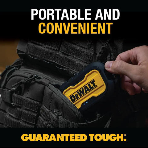 Person placing Heavy Duty Portable Charger Power Bank With IP67 Dust And Water Resistance, 10000 mAh Battery Pack into backpack.
