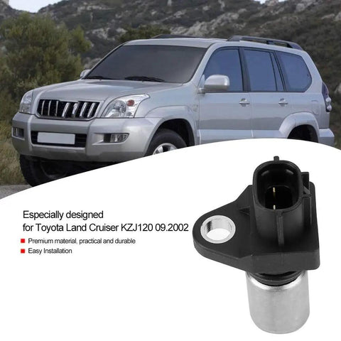 Street Ready Crankshaft Position Sensor Replaces OEM 9091905005 for Toyota Kjz90 in front of a silver Land Cruiser.